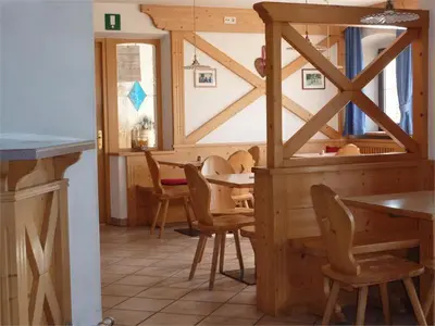 a dining room with a table and chairs at Gasthof Ebner Pfiffikus in Aldino