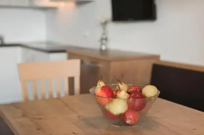 a bowl of fruit sitting on top of a table at Apparthotel Zunneler in Schenna