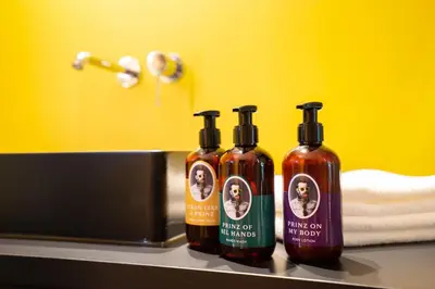 three bottles of hot sauce sitting on a counter at Prinz Rudolf Smart Hotel in Merano