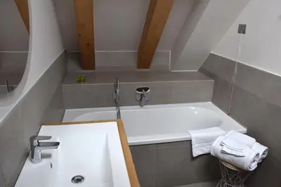 a kitchen and dining room with a table and chairs at Residence Langes in San Martino di Castrozza
