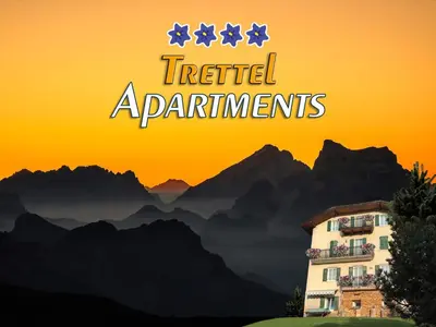 a sign that reads hotel apartments with mountains in the background at Apartments Trettel in Tesero