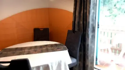 a bedroom with a bed and a window at Residence Wiesenheim in Trodena