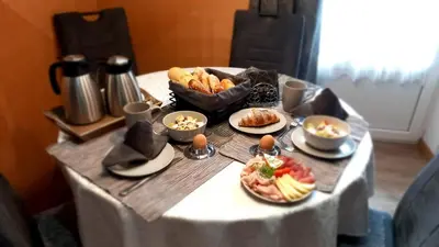 a table topped with plates of food on a table at Residence Wiesenheim in Trodena