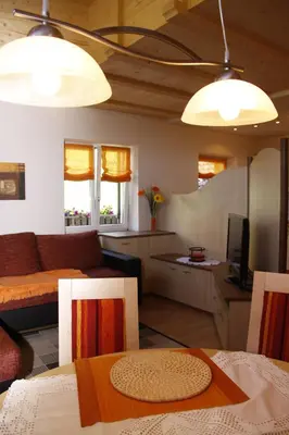 a living room with a couch and a table at Residence Wiesenheim in Trodena