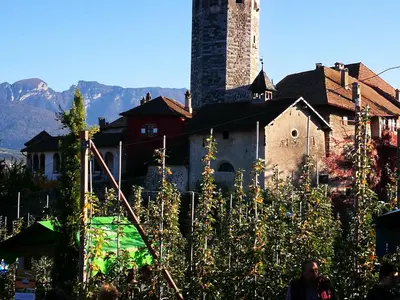 a building with a tower on top of it at Dolomiti Di Brenta in Ronzone