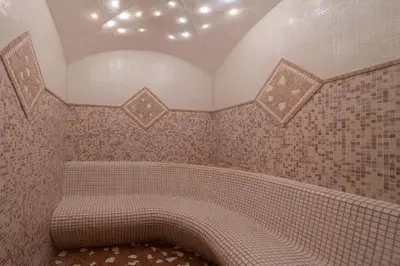 a tiled bathroom with a tub in a room at Cristallo B&B in Castelrotto
