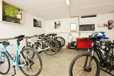 a group of bikes parked in a garage at Gasthof Hotel Terzer in Cortaccia