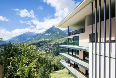 a house with a view of the mountains at Art & Nature Chalet Anna in Schenna