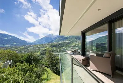 a house with a view of the mountains at Art & Nature Chalet Anna in Schenna