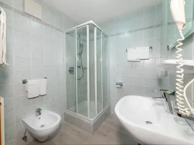 a bathroom with a shower and a sink and a toilet at B&B MARINA contacless check in in Santa Cristina in Val Gardena