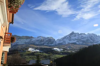 a view of a snowy mountain range from a building at Villa Alba in La Villa