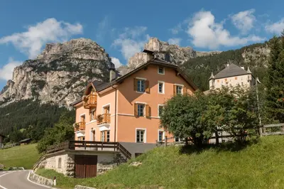 a house on the side of a hill next to a road at Villa Alba in La Villa