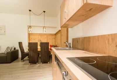 a kitchen with a sink and a counter top at Residence Fischerhof in Tirolo