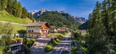 an aerial view of a village in the mountains at Garnì La Grambla in Selva di Val Gardena