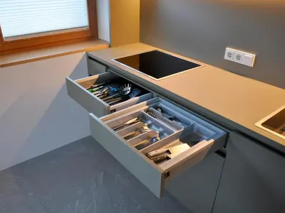 a kitchen with an open drawer in a counter at Apartments Frieda in Valdaora