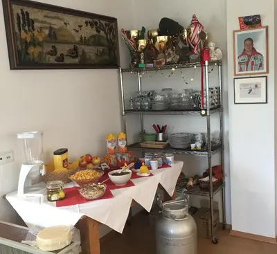 a table with some food on it in a room at Unterweger Hof in Avelengo