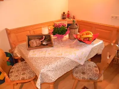 a dining room table with a plate of fruit on it at Unterweger Hof in Avelengo