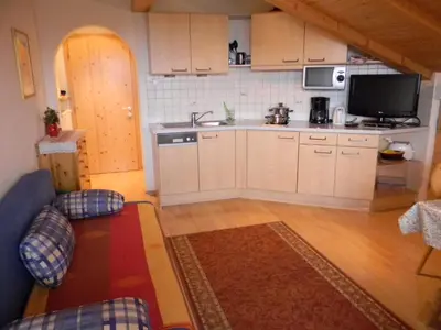 a small kitchen with a sink and a counter top at Unterweger Hof in Avelengo