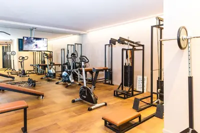 a room with a bunch of exercise equipment in it at Residence MAYR in Castelrotto
