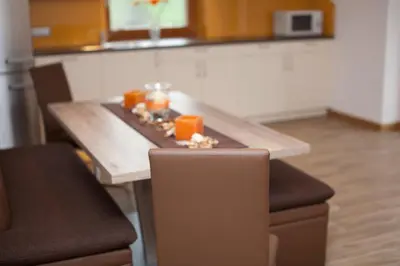 a wooden table with food on it in a kitchen at Appartement Bachguter in Avelengo