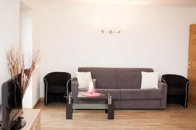 a living room with a couch and a table at Appartement Bachguter in Avelengo