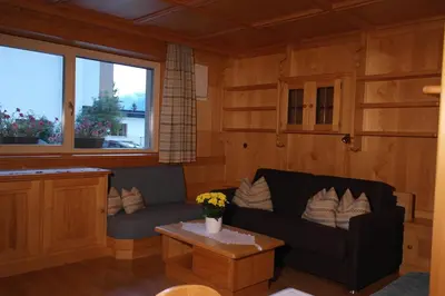 a living room with a couch and a table at Appartement Fischnaller in Mühlbach