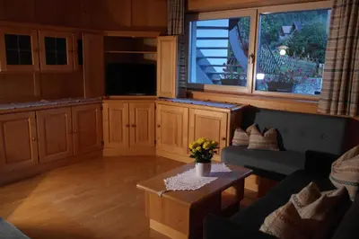 a living room with a couch and a table at Appartement Fischnaller in Mühlbach