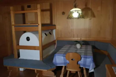 a toy kitchen with a table and a table and chairs at Appartement Fischnaller in Mühlbach