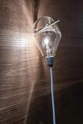 a light bulb sitting on top of a table at DESIGN APARTMENTS living Kampill in Bolzano