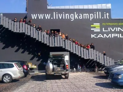 a group of people standing on the side of a building at DESIGN APARTMENTS living Kampill in Bolzano