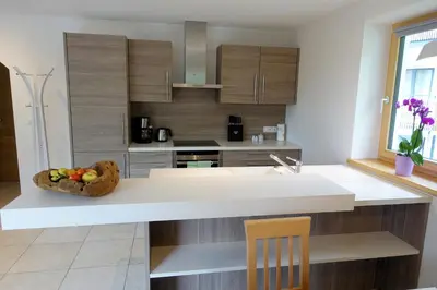 a kitchen with a bowl of fruit on a counter at Privatpension Bergkristall in San Martino