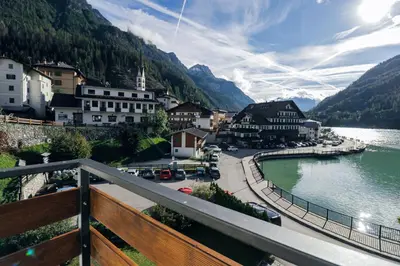 a view of a town next to a body of water at Una Civetta sul Lago in Alleghe