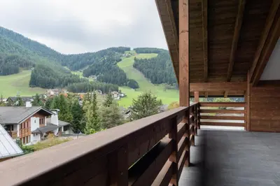 a balcony with a view of a valley at Ciasa Pradac in San Vigilio Di Marebbe