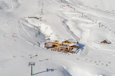 an aerial view of a ski slope with a ski lodge at Rifugio Salei in Canazei