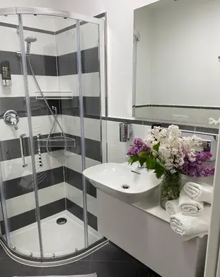 a bathroom with a sink and a mirror at Garni San Paolo in Appiano sulla Strada del Vino