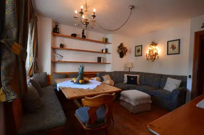 a living room with a couch and a table at Lungoboite 14 - Cortina in Cortina dʼAmpezzo