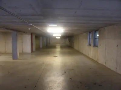 an empty hallway of an empty parking garage at Appartamenti Le Plejadi in Cavalese