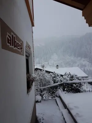 a person is skiing down a snow covered mountain at Apartment Albert in Santa Cristina in Val Gardena