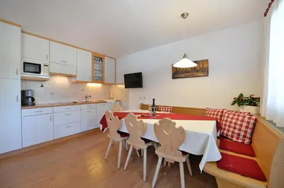 a living room with a table and a couch at Apartment Albert in Santa Cristina in Val Gardena