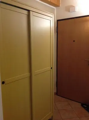 two closets in a room with a door at Home White in Laives