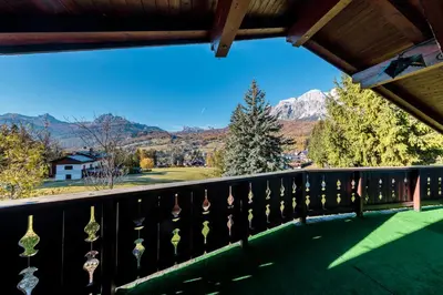 a balcony with a view of a mountain at Villa Ca Perosego - Stayincortina in Cortina dʼAmpezzo