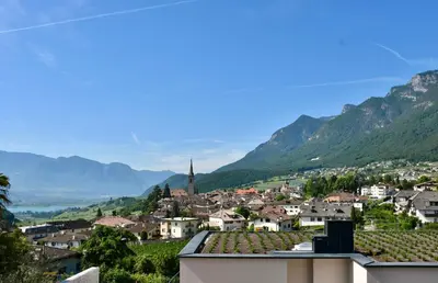 a view of a small town in the mountains at Haus Klavenz in Caldaro