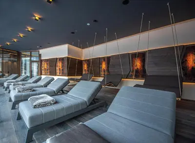 a waiting room with blue couches and chairs at Leitgam Adults Only Hotel in Chienes