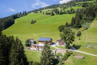 an aerial view of a house in a green field at Haubenthal in Villabassa