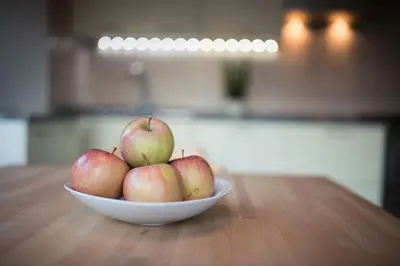 a bowl of apples sitting on a table at Josefshof in Caldaro