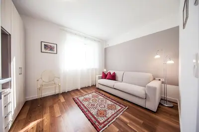 a living room with a couch and a rug at Josefshof in Caldaro