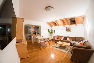 a living room with a couch and a table at Appartements Else in Ortisei