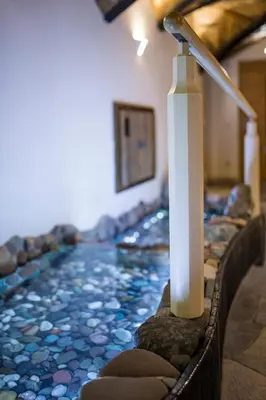 a long aisle with a water feature in a church at Boutique Hotel Pradell in Ortisei