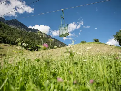a chair lift in a field of grass at Gasthaus Gasteiger in Lagundo