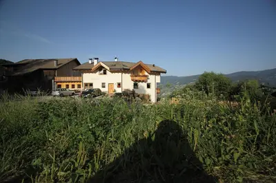 a house sitting on top of a field of grass at Solerhof in Laion